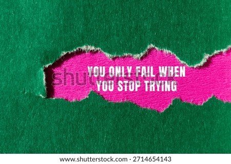 You Only Fail When You Stop Trying message written on ripped torn paper background. Conceptual You Only Fail When You Stop Trying symbol. Copy space.