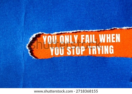 You Only Fail When You Stop Trying message written on ripped torn paper background. Conceptual You Only Fail When You Stop Trying symbol. Copy space.