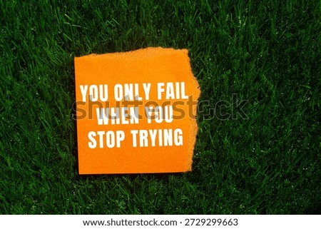 You Only Fail When You Stop Trying message written on ripped torn paper background. Conceptual You Only Fail When You Stop Trying symbol. Copy space.