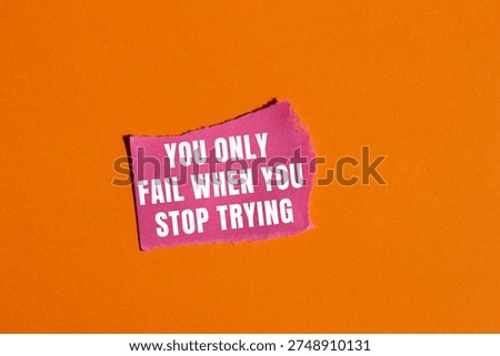 You Only Fail When You Stop Trying message written on ripped torn paper background. Conceptual You Only Fail When You Stop Trying symbol. Copy space.