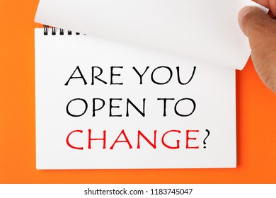 ARE YOU OPEN TO CHANGE Written On Notebook. Hand Turn Page.