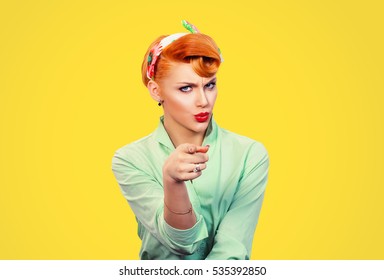It's you! Portrait angry annoyed pin up retro style woman getting mad pointing finger at you camera showing hand gesture this is you, you chosen isolated on yellow  wall background.  Negative emotions