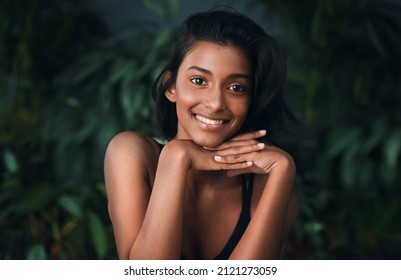 You are rare, luminous, and valuable. Shot of a beautiful young woman posing against a dark background.