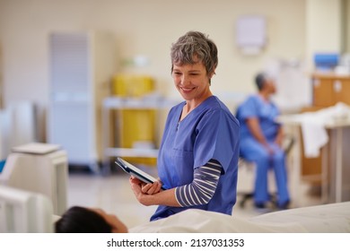 Are you ready for some good news. Shot of a nurse standing by her patients bedside. - Shutterstock ID 2137031353