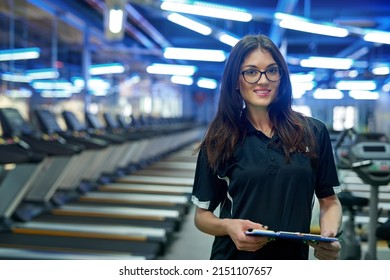 You ready for a workout. Portrait of a young personal trainer standing in the gym. - Powered by Shutterstock