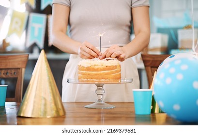 You should live everyday like its your birthday. Shot of an unrecognisable woman celebrating a birthday at home. - Powered by Shutterstock