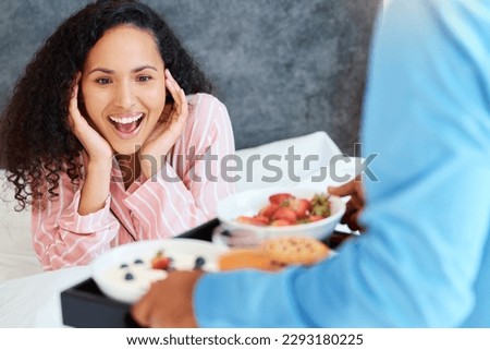 You shouldnt have. an attractive young woman getting served breakfast in bed by her unrecognizable husband.