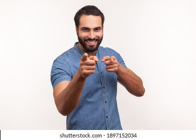 You are special! Positive happy man pointing fingers at camera and looking with toothy smile, believes in you, motivation. Indoor studio shot isolated on white background