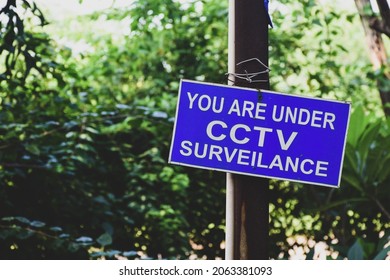 You are under CCTV surveillance signpost in the park. 