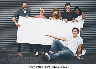 If You Want To Say Something, Say It Here. Shot Of A Diverse Group Of People Holding Up A Placard Outside.