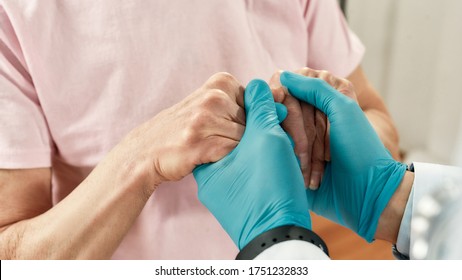 You Will Be Ok. Cropped Shot Of A Doctor In Blue Sterile Gloves Holding Hands Of Female Senior Patient. Healthcare. Working At Hospital. Medical Ethics. Medical Care And Support