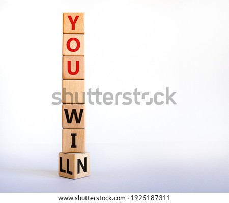You will win symbol. Turned a wooden cube and changed words you will to you win. Beautiful white background, copy space. Business, motivational and you will win concept.