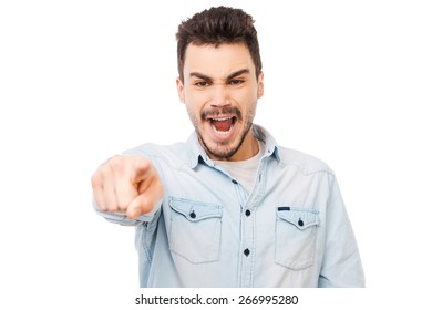 You Are Wrong! Frustrated Young Man Pointing You And Shouting While Standing Against White Background