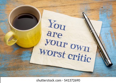 You Are Your Own Worst Critic - Handwriting On A Napkin With A Cup Of Espresso Coffee