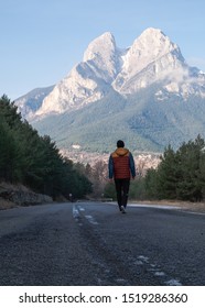 Youg Man Walking Towards Pedraforca, A Pyrenees Mountain Placed In Catalonia, Spain.