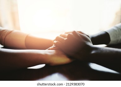 Youll never be alone. Closeup shot of two people holding hands in comfort. - Powered by Shutterstock