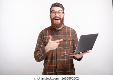 Youn Bearded Guy Is Excited About His Laptop On White Background