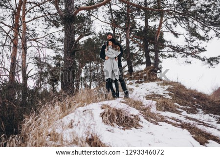 Similar – Image, Stock Photo Girl waiting at the side of the snowy mountain road looking down