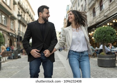 Young 30 Years Old Couple Walking In The Street