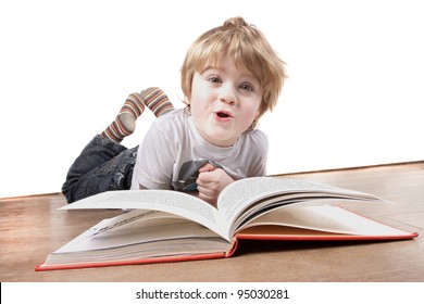 Young 4 Or 5 Year Old Reads A Book