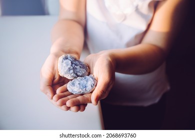 Young 7 Year Old Girl Child Holding Clusters Of Blue Crystals Called Celestite. An Indigo Child Concept, New Age Term.