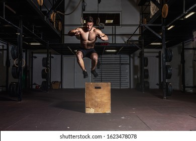 Young Active Strong Shirtless Sweaty Fit Muscular Man With Big Muscles Doing Box Jump Hardcore Cross Workout Training In The Gym Real People