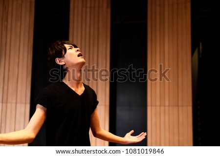 Young actor in a theater.