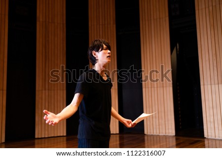 Young actor in a theater.