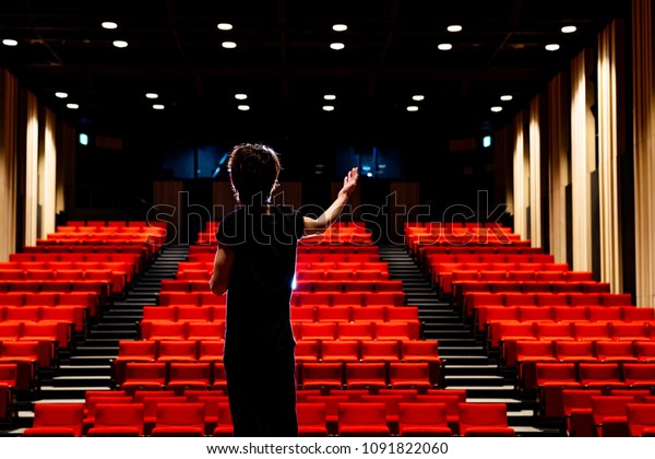 Young actor in a\
theater.