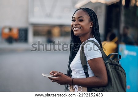 Similar – Image, Stock Photo Black woman traveler standing on rocky cliff