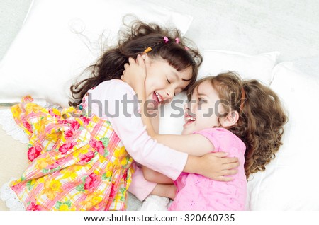 Similar – Little girl holding cookie sitting over the bed