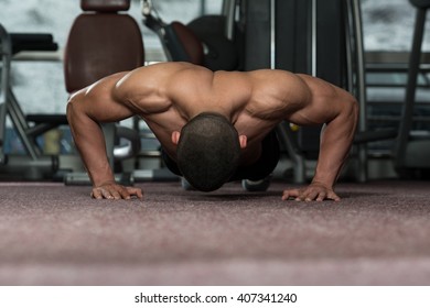 Young Adult Athlete Doing Push Ups As Part Of Bodybuilding Training - Shutterstock ID 407341240