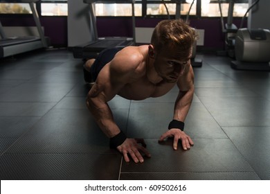 Young Adult Athlete Doing Push Ups As Part Of Bodybuilding Training - Shutterstock ID 609502616