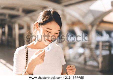Young adult business southeast asian beautiful woman wearing or remove face mask. City break people lifestyle with public health on day concept.