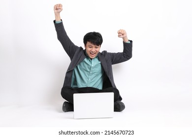 The young adult businessman sitting on the white background. - Powered by Shutterstock