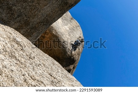 Similar – Image, Stock Photo Rock climber clinging to a cliff.