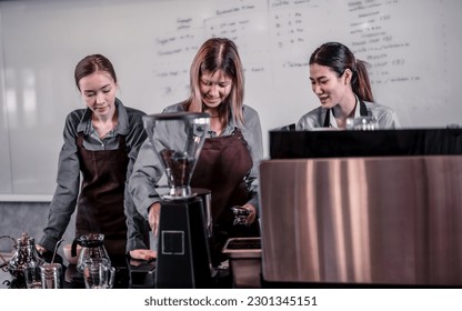 Young adult coffee makers work with skilled baristas to create menus. Using a coffee machine to make hot and cold coffee. Experiment with grinding and blending, including adding milk foam on top. - Powered by Shutterstock