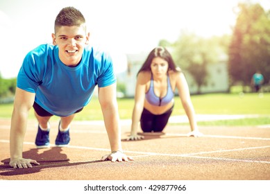 Modern Couple Doing Exercise Urban Area Stock Photo (Edit Now) 1574903278