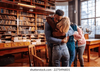 A young adult couple is in a mental health therapy embracing each other in session. - Powered by Shutterstock