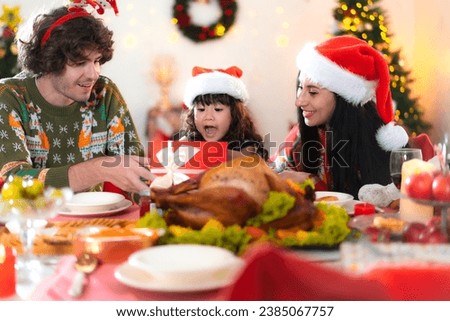 Young adult family celebrating xmas Christmas thanksgiving together in dining room with yummy roasted turkey enjoy present. People celebrate christmastime with good taste food and drink, gift and wine