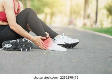 Young adult female with his muscle pain during running. runner woman having leg ache due to Ankle Sprains or Achilles Tendonitis. Sports injuries and medical concept - Shutterstock ID 2285298473
