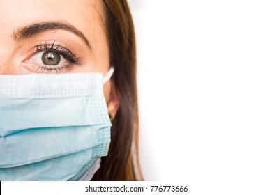 Young Adult Female Wearing Surgical Mask; Portrait Showing Left Side Of Face; Copy Space (Doctor, Physician, Nurse, Tech, Caregiver)