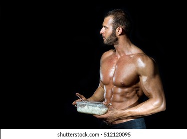 Young Adult Fit Muscular Bodybuilder Eating Healthy White Rice From Plastic Dish Isolated.