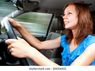 Young Adult Girl Driving A Car First Time