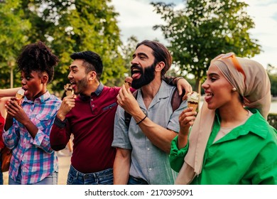 A Young Adult Group Of Multi Racial Friends Are Being Silly And Are Licking Ice Cream In The City Street