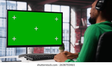 Young adult at home office analyzing data charts on mockup computer, interpreting statistical graphs and identifying trends. Reviewing analytical reports and processing info. Camera A. - Powered by Shutterstock - Get 15% off with code: PIKWIZARD15