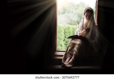 Young adult jewish arab ethnic alone human scarf veil cloth devote old life hope light dark black door backdrop page view text space. Sad lone pretty islam arabian white lady face hous seat stair step