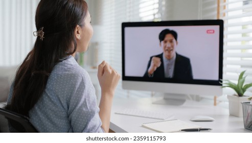 Young adult man asia people give great admire praise online speech coach mentor thumbs up clap hand for remote work at home workforce in CEO town hall happy live video call talk to camera screen. - Powered by Shutterstock