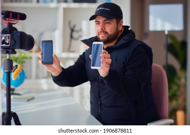 Young Adult Man Creating Online Content For The Channel, Daily Vlog, Unboxing A Brand New Phone At Home, Online Sales