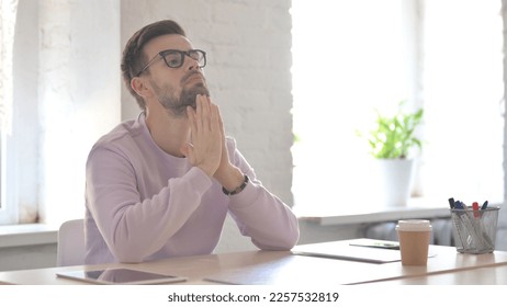 Young Adult Man Feeling Worried While Sitting in Office - Shutterstock ID 2257532819